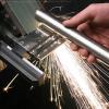 Product shot of Addison Manufacturing grinder in action with sparks during time exposure photo in the studio