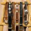 Leather belts hanging on a decorative ladder