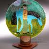 Product shot of Bovell Builders metal sculpture with Kathleen Wallace infusion glass plate with rider on horseback