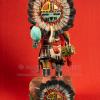 Kachina sculpture on red background