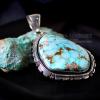 Product shot of Native American silver and turquoise pendant with Kingman turquoise
