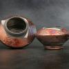 Product shot of Joni Pevarnik's brownish-copper raku glazed bowls